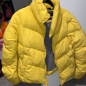 Bright yellow A&F puffer jacket